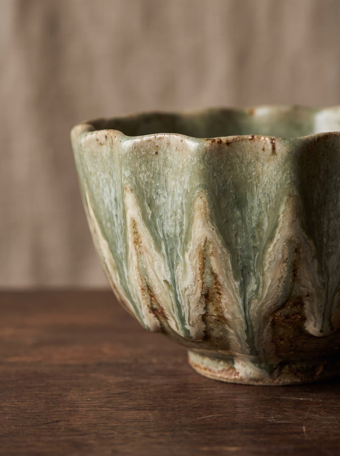 Close-up of kiln-changed glaze on a MIRUKII matcha bowl — each chawan fired with a unique pattern